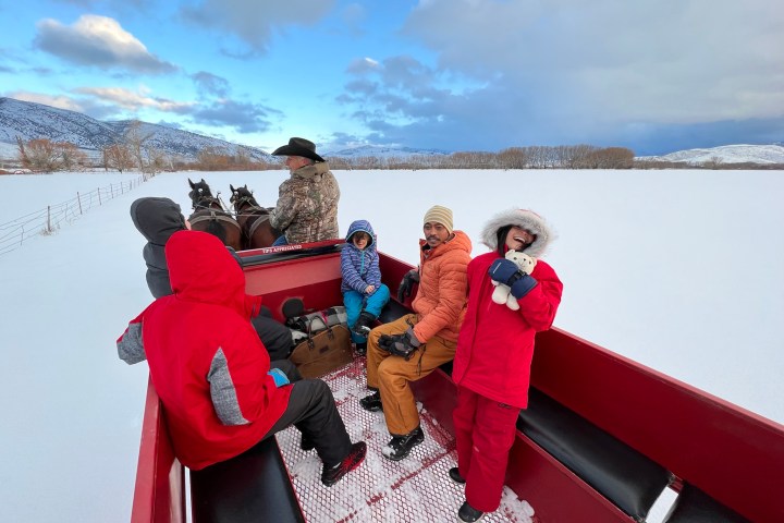 a couple of people that are standing in the snow