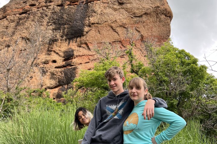 a person standing in front of a mountain