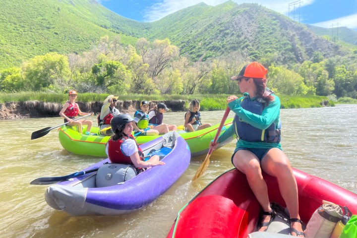 Kids paddling on the river