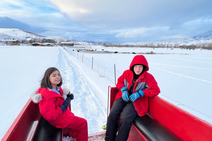 a woman sitting on the snow