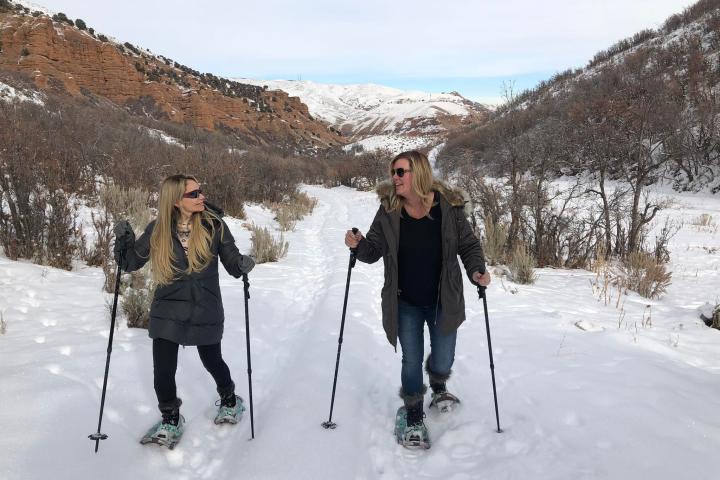 a group of people cross country skiing in the snow