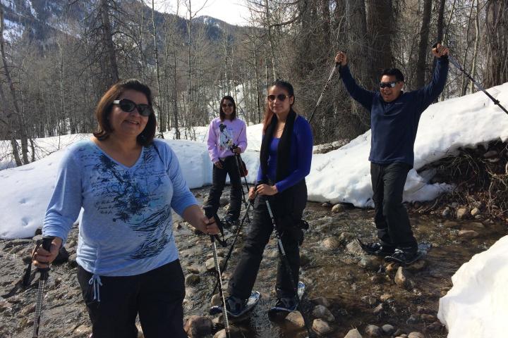 a group of people standing in the snow