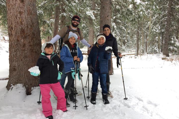 a group of people cross country skiing in the snow