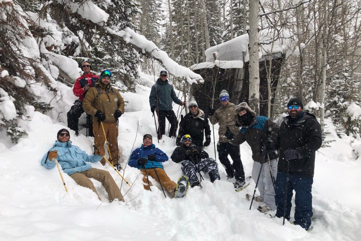 a group of people skiing on the snow
