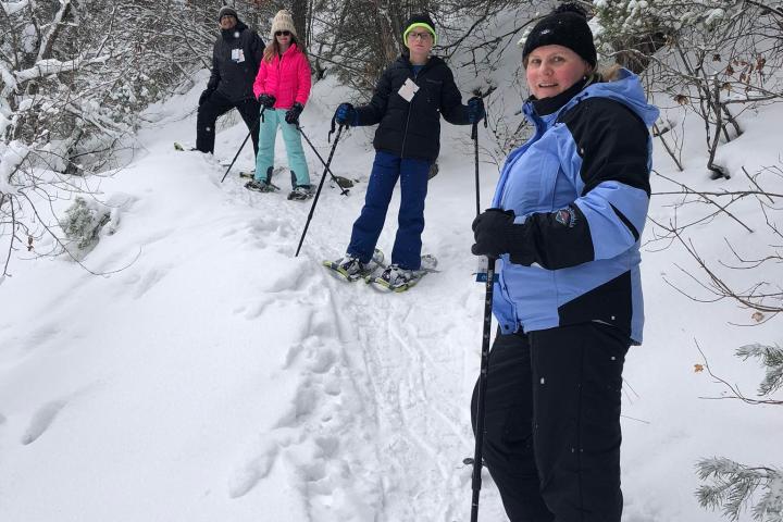 a group of people cross country skiing in the snow