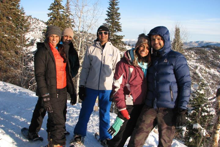 a group of people standing in the snow
