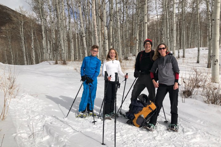 a group of people cross country skiing in the snow
