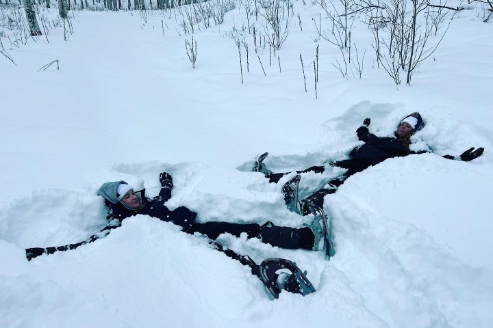 snowshoeing to make snow angels