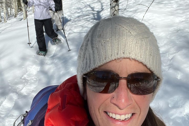 a man and a woman taking a selfie in the snow