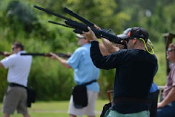 a person swinging a baseball bat on a field