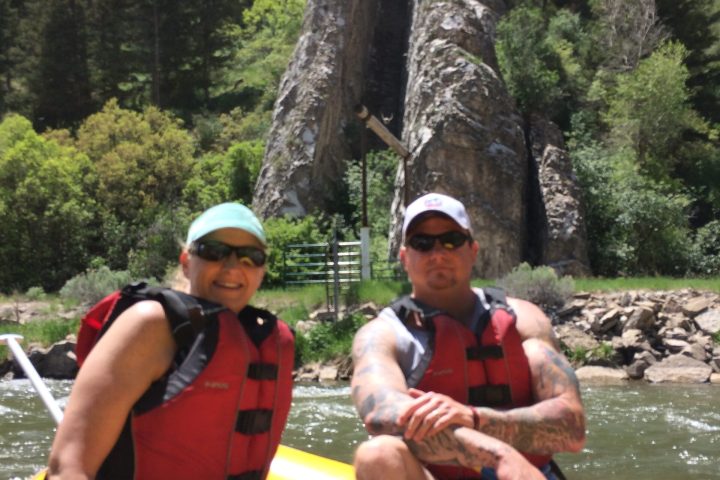 a group of people rowing a boat
