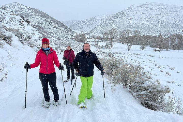 a group of people snowshoeing in Lost Creek Utah